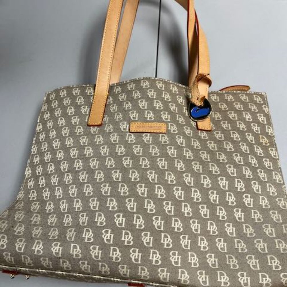 Dooney & Bourke cloth signature handbag/purse w leather straps. Light brown/tan.